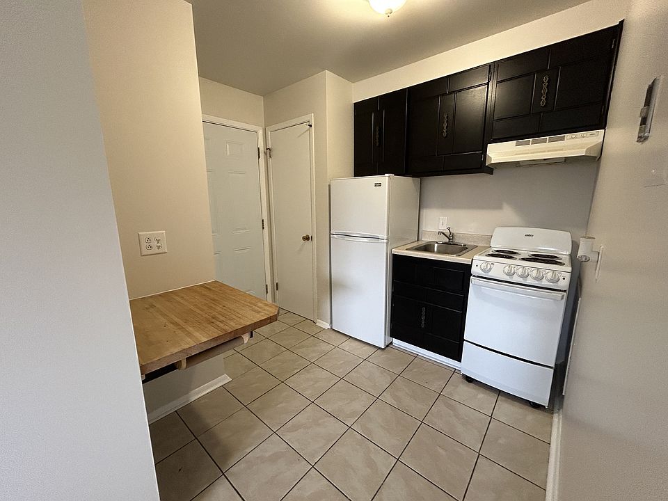 Studio economy kitchen, pantry and built-in table.