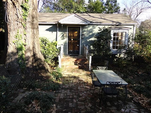 This Cottage sits under a 100+ year old oak tree. Patio furniture and tree swing are included with rental.