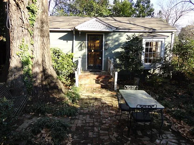 This Cottage sits under a 100+ year old oak tree. Patio furniture and tree swing are included with rental.