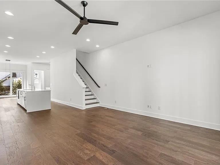 Living Room (Note: Actual unit has light wooden floors and upgraded fixtures / appliances)