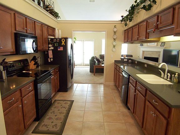Galley Kitchen with Corian Counter Tops