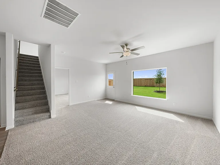 The open layout connects the kitchen with the dining room and family room.