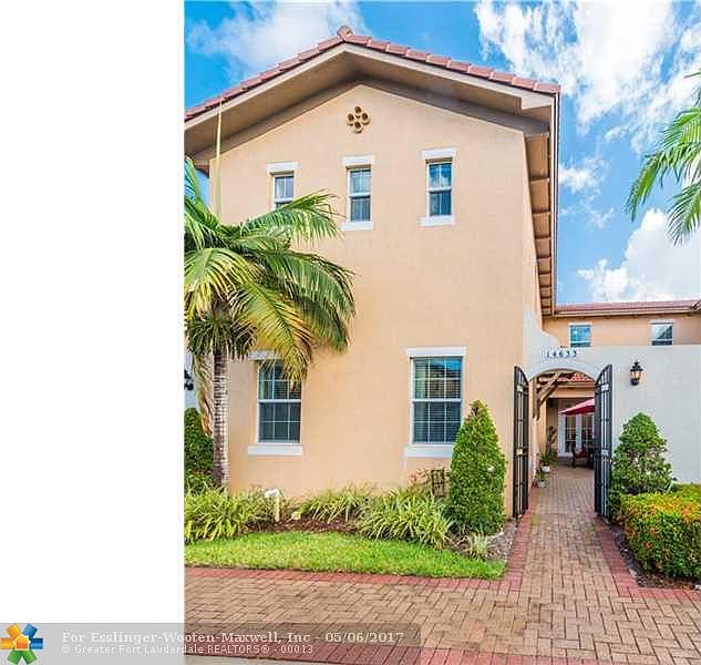 Impressive Mediterranean Inspired Town Home In Highly Desired West Pembroke Pines Gated Community.