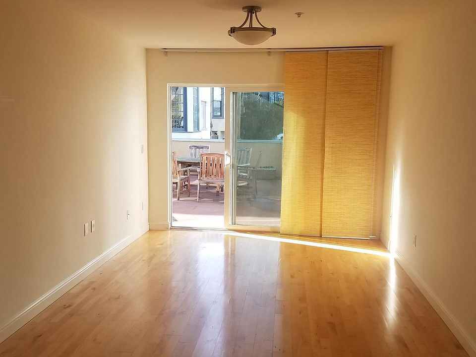 Hardwood living room overlooking huge patio access.