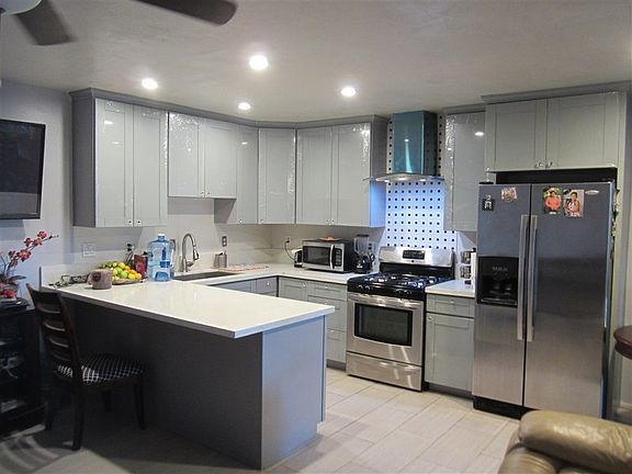 Wide Open Kitchen / New Kitchen Cabinets  / Sink/ Stove / Range Hood