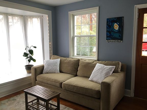 Sunny and relaxing living room with pull-out queen sofa bed.