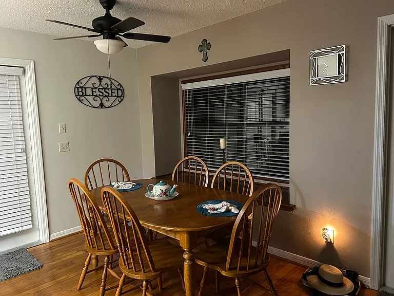 Dining room table has leaf added for seating of 6