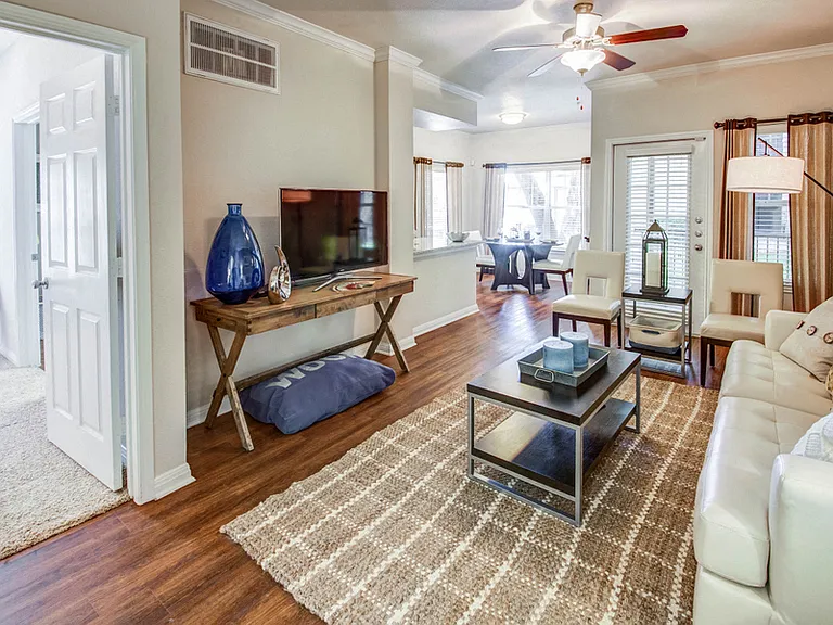 Open living room with access to bedroom and kitchen