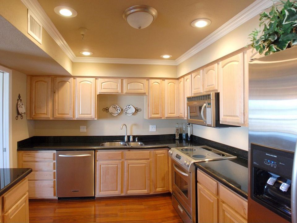 Kitchen features granite and stainless