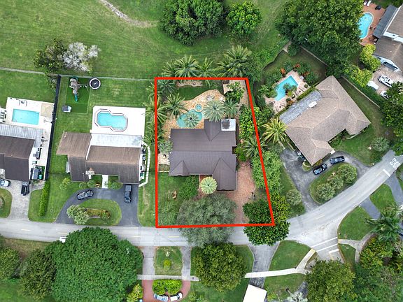 Aerial view with the property outline to show the full size of the lot.