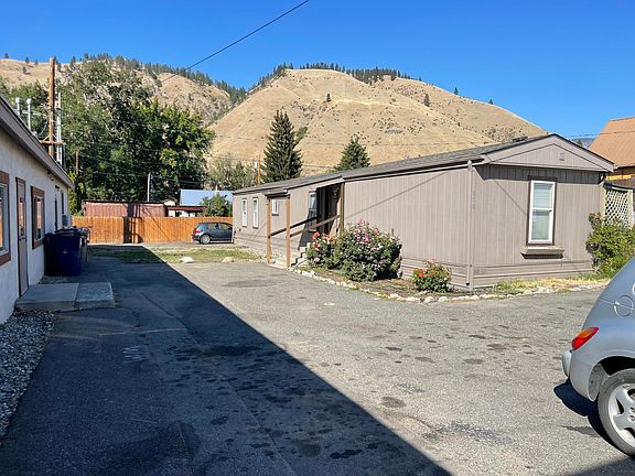 4 private parking Spaces at rear of property; around back.