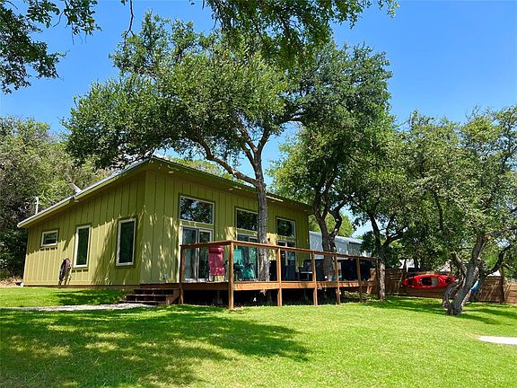 The Cabin Features a Large Deck for Relaxing, Grilling and Entertaining, and Large Grass Lawn for Yard Games.