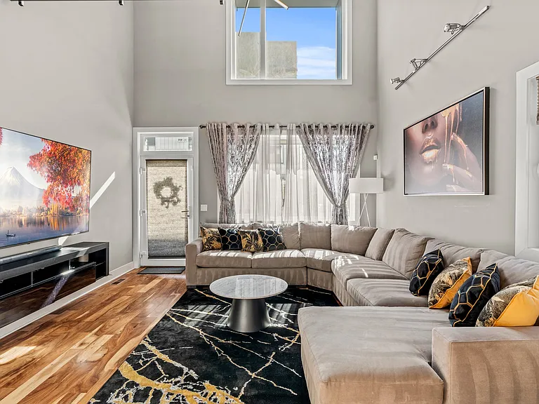 Dramatic two-story living room / front entrance
