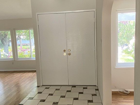 Entry way, showing front door. Living Room is to the left in photo, den-office is to the right.