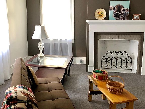 Front room with fireplace (non working) - lots of light and great space