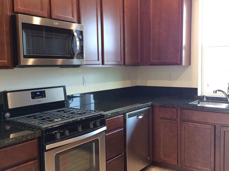 Kitchen comes with stainless steel refrigerator & extra cabinets..