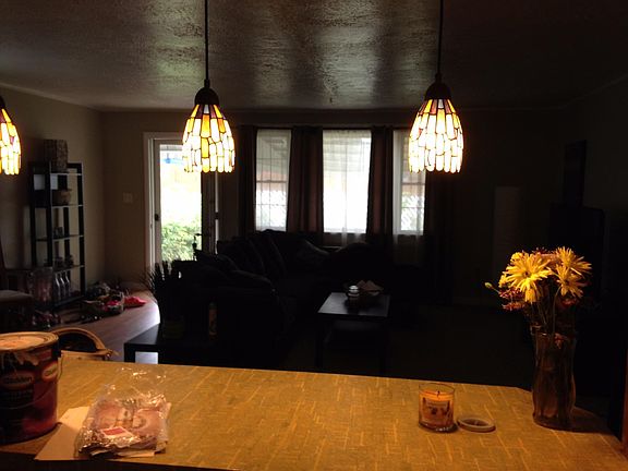 In kitchen looking into livingroom. Overlooks cement patio a