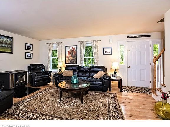 Hard wood flooring, heat efficient pellet stove all add warmth and comfort to this homes living/family room.