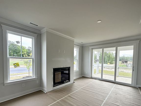 The living room of the Mason on Homesite 2286 at Wendell Falls by Brookfield Residential