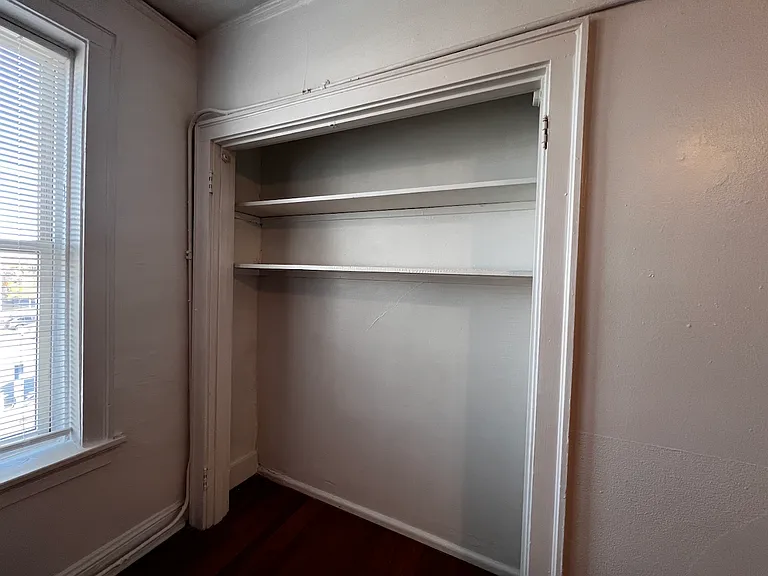 The first closet maximizes vertical storage while leaving room to utilize the opening as an extension of the room rather than a traditional closet.
