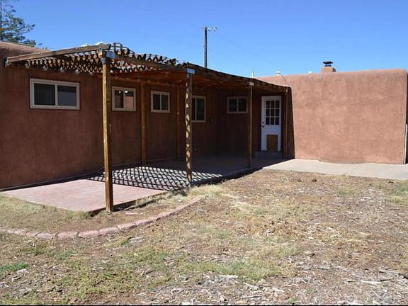 large backyard with covered patio