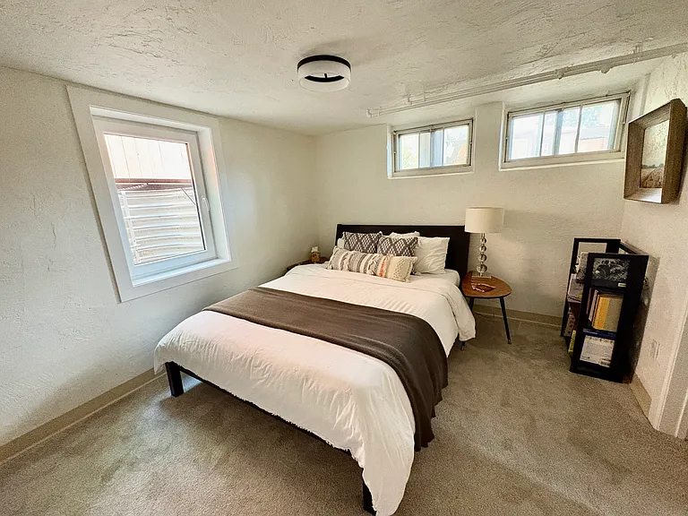 Lower level bedroom including two bright backyard facing windows and side yard facing egress window