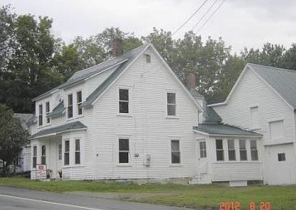 Side of house and barn