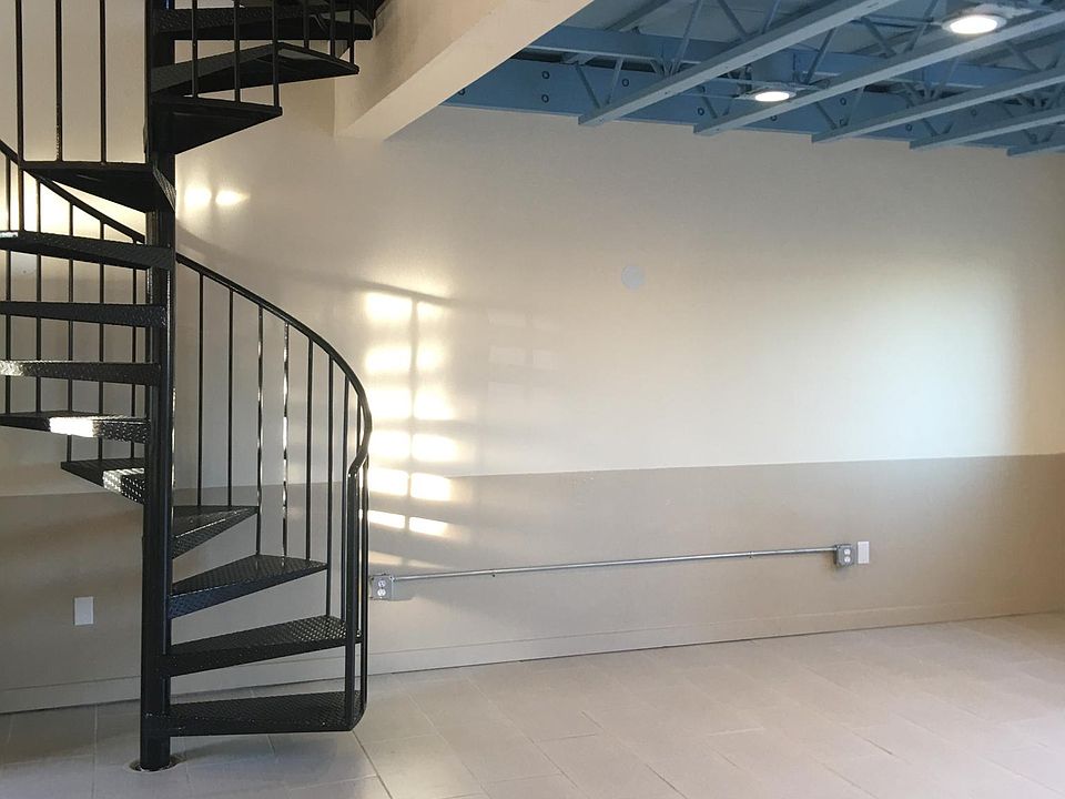 Living room area and spiral stairway