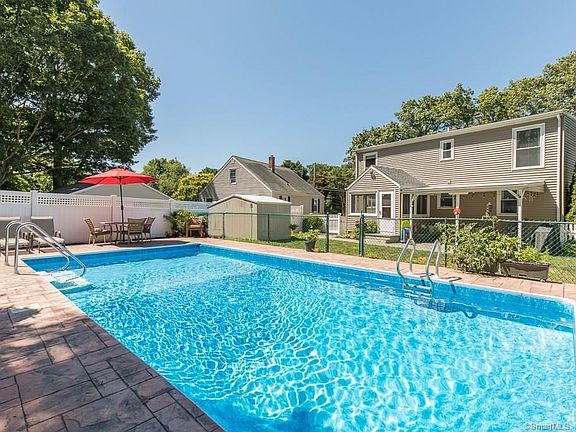 Beautiful in ground pool with stamped concrete patio