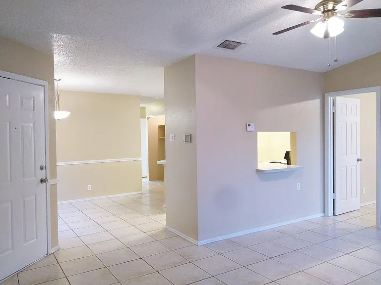 Side Entrance into Living Room into Master