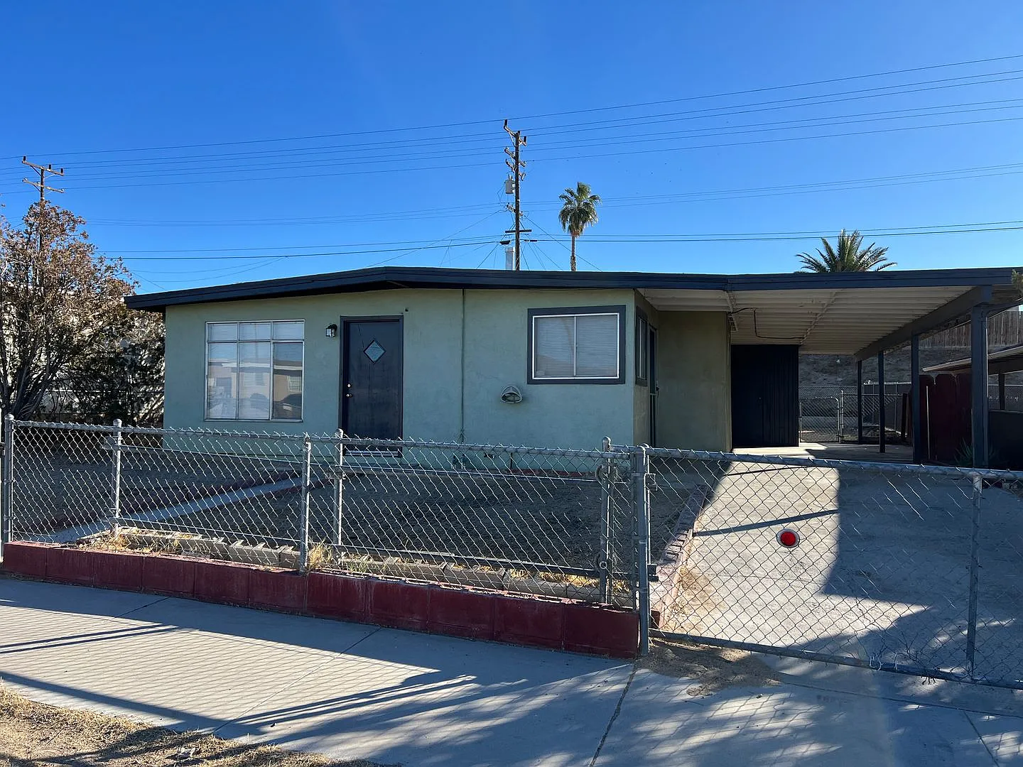 3 Bedroom House with New Paint, Wood Flooring & Carport — Photo 1