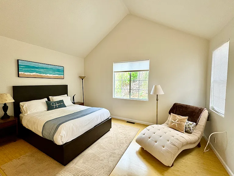 Spacious Master bedroom with queen size bed, lounger and full bathroom