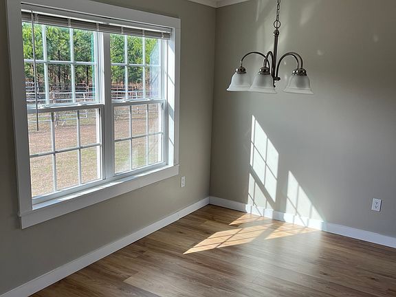 Dining Room: Open to Living room with vaulted ceiling.