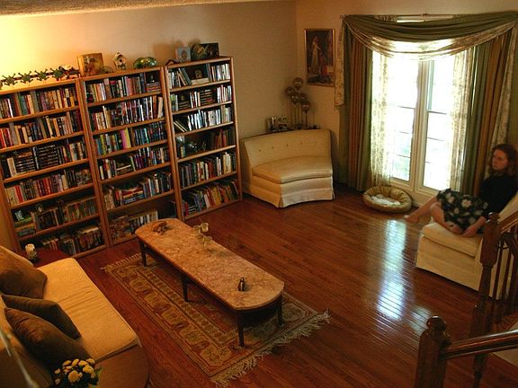 View from open stairs down to living room