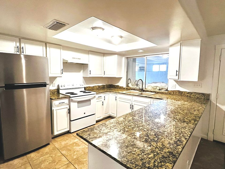Spacious kitchen with granite countertop. All major appliances included.