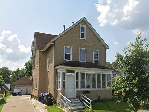 Front view of home with detached garage