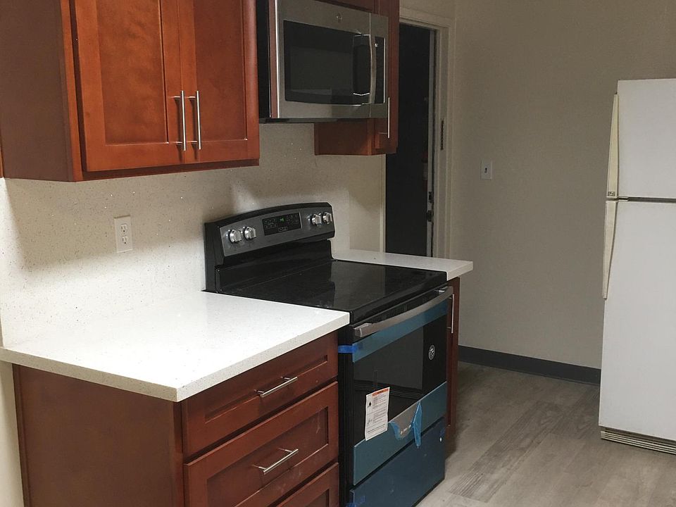Newer stove, oven, microwave, counters, cabinets and floor
