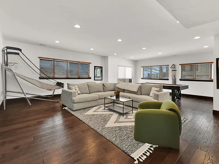 Downstairs living room-
Two bedrooms, full sized bathroom, large tv, pool table, and basketball game