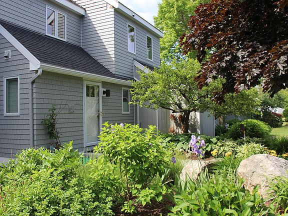 Entrance has lovely perennial gardens. Snow plowing and shov