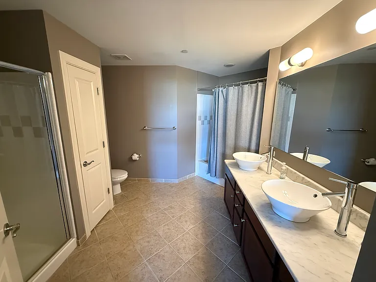 Bedroom #1: Bathroom with shower, tub, dual-sinks