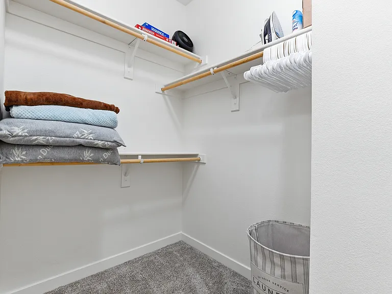 Spacious walk-in closet with ample storage.