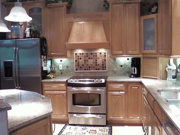 Kitchen with GE Profile Refrigerator and trivection oven