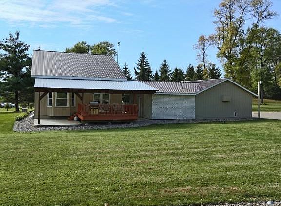 Chalet style home on 3 acres with separate shop area and 30 x 38 outbuilding.