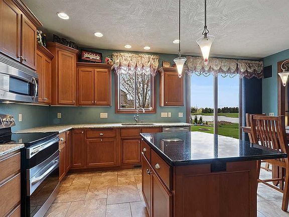 Off set cabinets and granite counters throughout make this kitchen a real cook's delight.