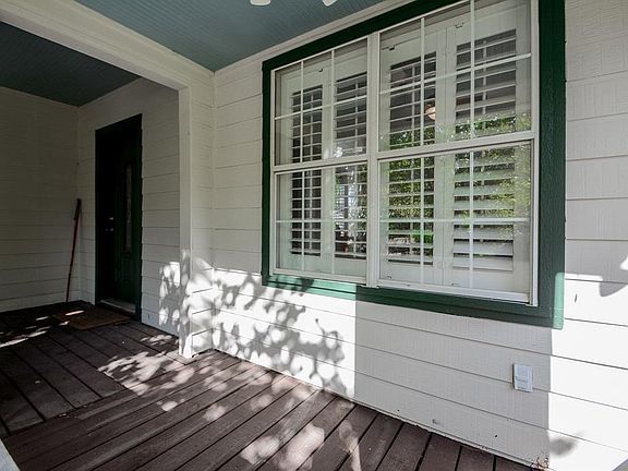 One of several covered porch areas welcomes you home.