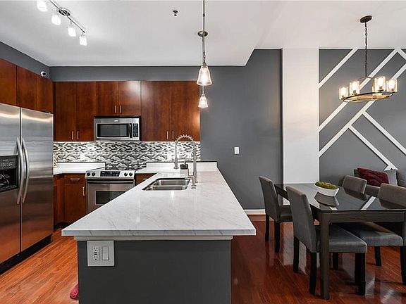 5th image of 711 Cosmopolitan Dr NE Unit 209