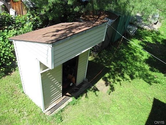Looking down from the balcony onto the shed.  Even though there's a full basement, the shed is a place for your tools.