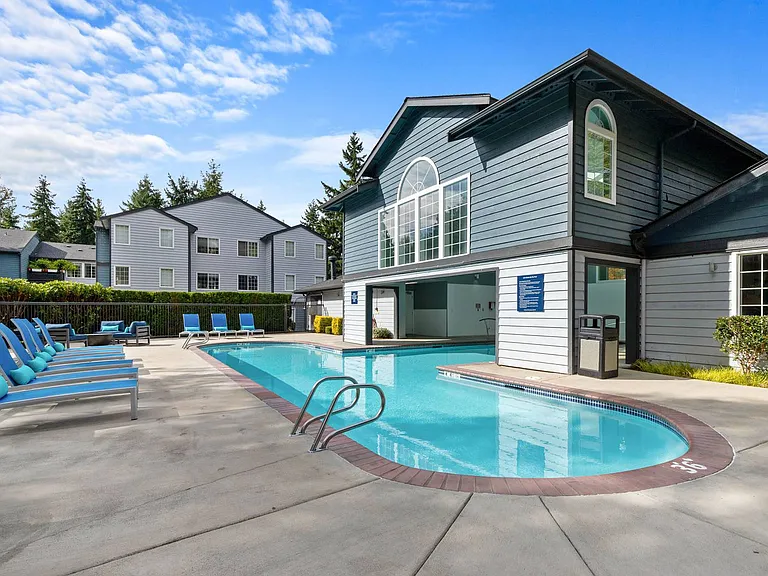 Lounge in style beside our sparkling pool surrounded by lush greenery