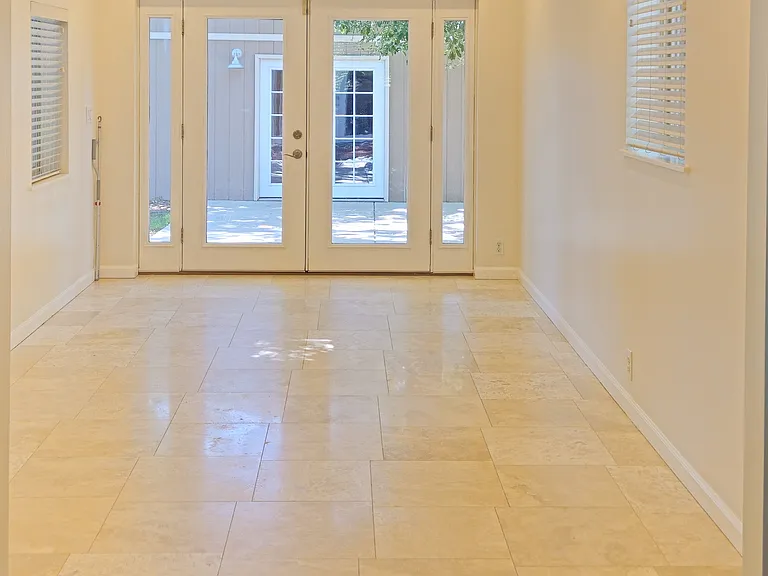 Flexible space with French doors to the outside can be used for dining, tv or office!