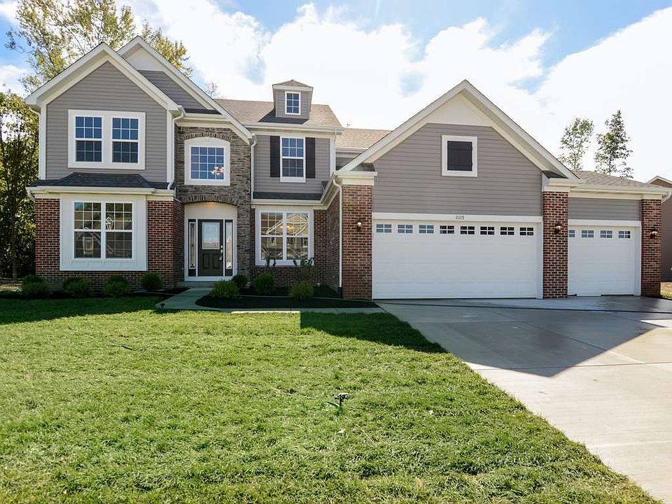 Serene lot set against the wooded pond area.
